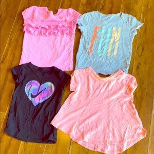 Bundle of 4 girls shirts. Sizes are 5 and 5t.